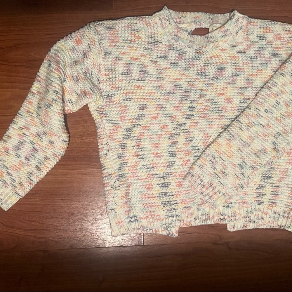 Mid-weight sweater with open back.  Could be used all season long!